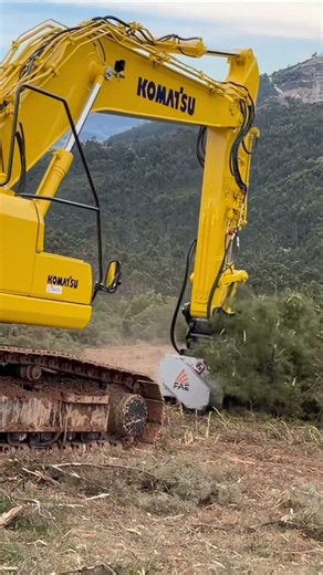FAE UML/HY forestry mulcher in action with a Komatsu excavator