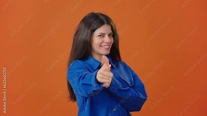 Woman points finger and shows thumbs-up nodding approvingly