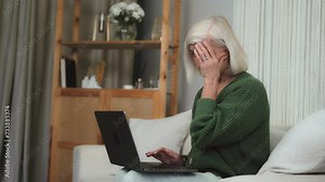 Mature attractive old retired exhausted senior use computer remote distance working. Grandmother studying online new language, having virtual digital training on laptop at home office room Stock Video