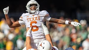 Joshua Moore hauls in a 10-yard TD pass for Texas
