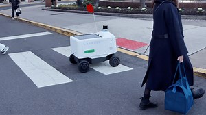 Food delivery robot rolls on through icy streets in Dallas