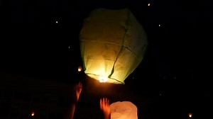 Releasing Glowing Sky Lanterns into the Night