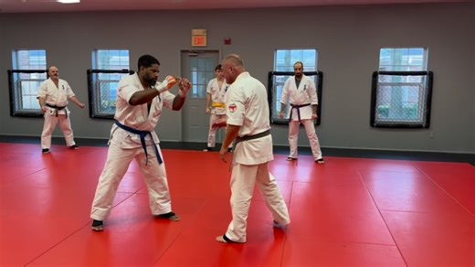 Another way to throw the inside leg kick with more power is by stepping off the centerline with your right leg first. From there, you’re going to drive your left shoulder through the target line and let your hip follow through the kick. Instead of just standing in front of your opponent and flicking a light inside kick — which is fine when you’re just testing distance or using it like a jab — this variation lets you commit more force. For example, you might throw a quick left-right combination, 