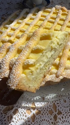 Crostata al limone 📍Italy 🇮🇹 Crostata al limone is a classic Italian lemon tart made with a buttery shortcrust pastry filled with a smooth, tangy lemon cream or curd. The filling is typically rich yet refreshing, balancing sweetness and citrusy sharpness. While fruit jams are the most classic fillings, lemon became a popular variation, especially in southern Italy where citrus fruits are abundant. Served during Sunday lunches, holidays, or festive gatherings, crostata al limone represents the