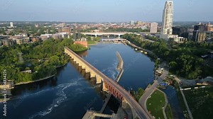 The Famous Stone Arch Bridge Built Over the Mississippi River and the I-35W Saint Anthony Falls Bridge In the Background Minneapolis, Minnesota, United States. Aerial Drone Shot
