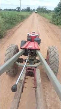 Riding a Two-Wheel Tractor on a Dusty Country Road 🚜🌾