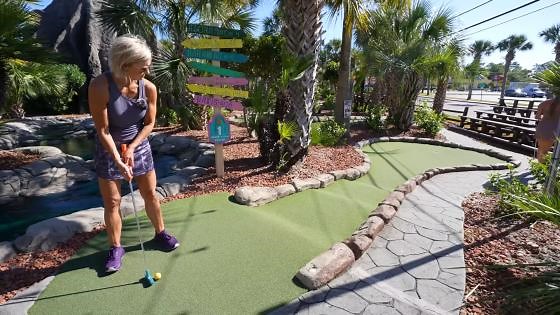 Elisha Scores a Hole In One at Mini Golf