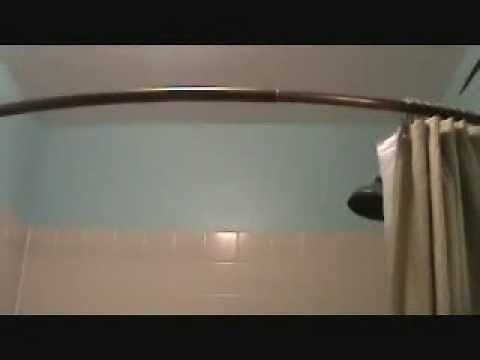 Installing a curved shower curtain rod