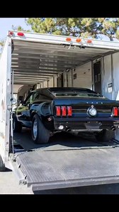 black classic American muscle car, most likely a Ford Mustang Convertible from the late 1960s (e.g., a 1969 Ford Mustang Convertible). #musclecar #musclecarsdaily #musclecarspictures #oldcars #retrocars #classicmusclecars #americanmuscle #RetroRides #vintagevibes #carculture #OldSchoolCool #LegendaryCars #fblifestyle | Classic Car Vault
