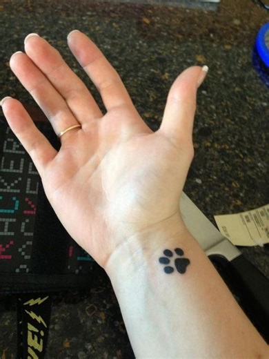 Dog paw wrist tattoo | Orangetattooshop.com