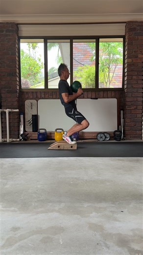 67yrs 24kg “24 kg kettlebell sissy squat from 4” platform – full knee extension under load”