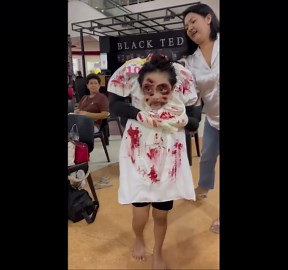 Kid wears creepy headless ghost costume to Halloween party