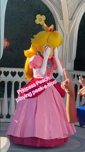 Princess Peach mascot playing Peek-a-boo with a baby at Super Nintendo World #supermario #nintendo