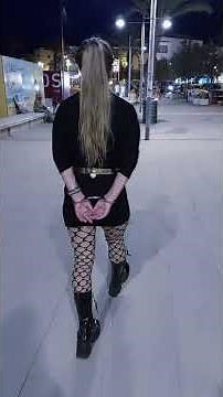 Handcuffed walk on the waterfront, in Handschellen auf der Uferpromenade - Llançà, Spain