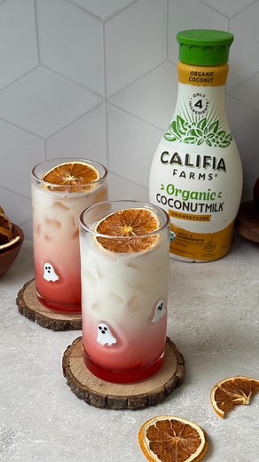 make these hauntingly pretty mocktails for spooky season, made with creamy @califiafarms Organic Coconutmilk 👻#califiapartner 🥥 to a shaker, add 100ml pineapple juice, 35ml lime juice, 70ml Califia Farms Organic Coconutmilk, and ice 🥥shake until combined and pour into a glass 🥥top with more ice and Coconutmilk 🥥pour in 1 tbsp grenadine and garnish with a dehydrated orange slice | 𝐚𝐦𝐚𝐥𝐢