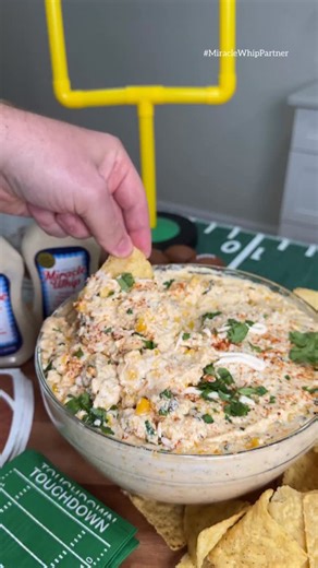 No Game Day is complete without Street Corn Dip! Grab a bottle of @miraclewhip to make this dip for your next tailgate. Recipe ⬇️ Recipe: 1 cup Miracle Whip 2 cans drained corn 8oz pepper jack cheese 16oz cream cheese ½ cup sour cream 1 handful fresh cilantro, chopped 2–3 tbsp Tajín seasoning (to taste) Cotija cheese, Miracle Whip and tajin to garnish Grab a bottle of Miracle Whip at a Grocery Store near you, so you can give this recipe a try | G_Bque