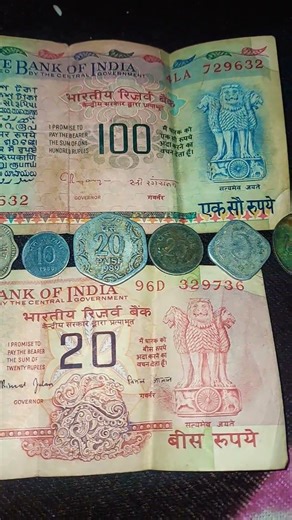 vintage Indian currency, including banknotes and coins, which are popular collectibles.