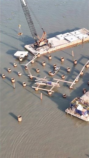 Overview of the pedestrian bridge construction site sponsored by Nutifood: Bustling construction ...