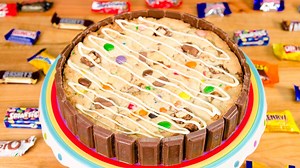 1.2K reactions · 444 shares | Giant Cookie Candy Cake! Watch the full tutorial here: https://youtu.be/AZahpQxdPM0 Save this idea for your leftover Halloween candy! | Cookies Cupcakes and Cardio | Facebook