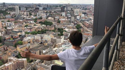 Group climbs to elevated viewpoint overlooking London