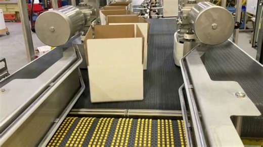 Metering Belts Achieve Precision Merge of Full Cases by Multi-Conveyor