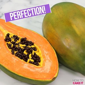We're feeling fruity!! These Giant Papaya Cakes are extra ripe! Each one is made of vanilla cake dyed a tropical peachy pink color to resemble fresh papaya flesh and iced with a sweet yellow Italian meringue buttercream. We filled the cavities in each cake with shiny dark chocolate crisp pearls for the seeds then covered them in yellow fondant painted to perfection! | How To Cake It