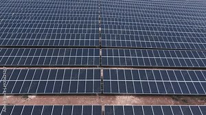 Aerial perspective of a vast solar panel array, capturing the clean energy source's expansive and orderly layout.