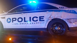 2 Gwinnett police cars struck on I-85