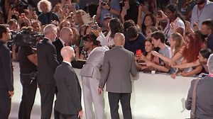 Timothee Chalamet took a moment to greet and hug crying fans on the red carpet in Italy. Timothee was attending the premiere of his new film 'The King' at the Venice Film Festival. | ODE