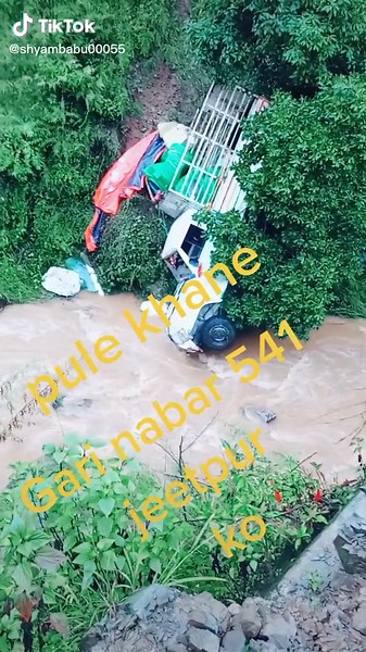 Landslide Aftermath: Truck and Tractor in Flooded Area
