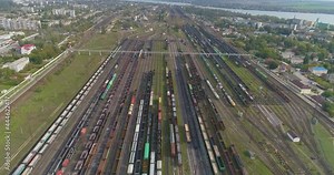 Freight trains stand at the railway junction top view. Fly over a large railway junction. Stock Video