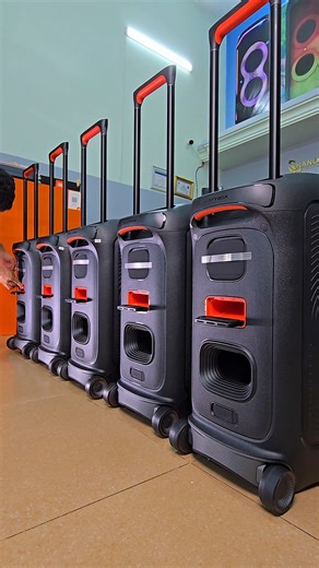 The standard JBL PartyBox Stage 320 unboxing reveals the speaker itself, an AC power cord, a Quick-start guide, and a Safety Instruction and Warranty Card. Some retailers may offer bundle kits with additional items like microphones. Included Contents Upon opening the box, you can expect to find the following items: -1 x JBL PartyBox Stage 320: The main portable party speaker unit, featuring a telescopic handle and sturdy wheels for transport. -1 x AC power cord: The specific quantity and plug ty