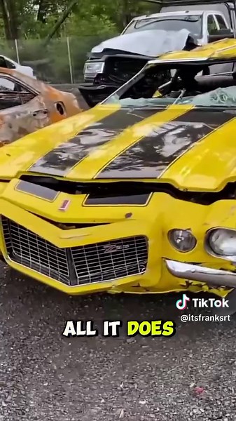 found this absolutely mangled 1971 Chevy Camaro Z28 at the salvage yard today. It looks like it took a serious rollover! The roof is crushed, but it's still got the classic yellow and black