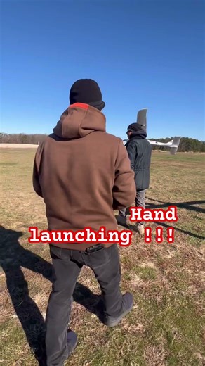 Hand launching a powered glider