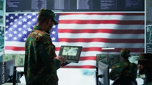 US soldiers operating in a high tech cybersecurity command post, managing state secrets and classified information. Protecting servers against digital threats and cyber warfare. Camera B. Stock Video