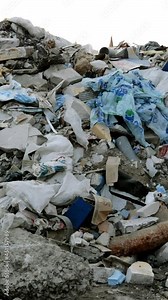 Industrial and household waste. Large garbage pile. Degraded garbage. Dirty and stink waste in trash dump or landfill. Environmental damage concept. Vertical format. Close-up.