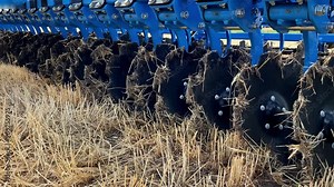 Close-up of a large modern plow disc harrow for cultivating the land.