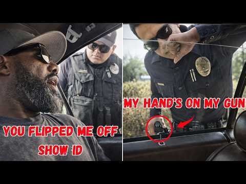 Cop Gets Flipped Off By Driver, Then Tries To Intimidate With Hand On Gun