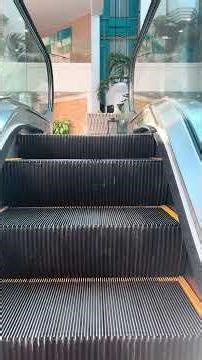 Beautiful clear sided OTIS escalators at Renaissance wind creek resort, casino and mall in Aruba.