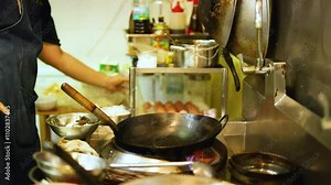 Chef Cooking in Bangkok Kitchen