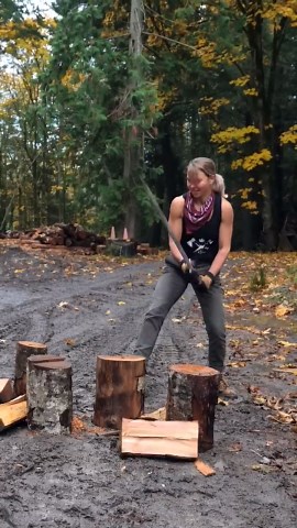 Traditional wood splitting in rural countryside with Viking wood splitter