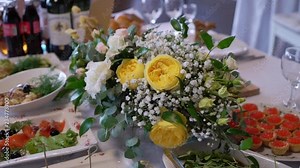 Banquet decorated table, with cutlery. Wedding decor in the banquet hall. Serving of a festive table, plate, napkin, knife, fork. Table setting decoration. Romantic Dinner or other events - wedding