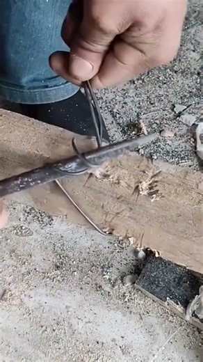 This is a wire that is being tightened using an iron rod