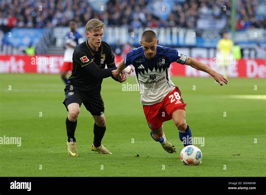 2026.04.04 xfsx Fussball 1. Bundesliga Hamburger Sportverein - FC Augsburg v.l. Anton Kade (30, FC Augsburg) , Miro Muheim (Hamburger SV ,28) in aktion, in action (DFL regulations prohibit any use of photographs as image sequences and/or quasi-video. (Photo by HMB Media/Fernando Soares/Sipa USA Stock Photo - Alamy