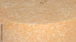 Cheese production workshop in a dairy factory. Conveyor line at the dairy plan. Filling the mixture before pressing. Yellow cheese production line for cheese factory.