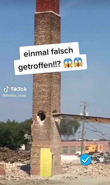 Demolishing a Tall Red Brick Chimney: An Explosive View