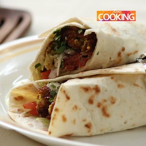 117K views · 1.8K reactions | Falafel Wrap! FULL RECIPE: https://goo.gl/n8wYnE Falafel Recipe: https://goo.gl/eKWEf1 #falafel #falafelwrap #wrap #quickwraprecipes #recipes #food #cooking #easyrecipes #homecooking #tasty #chickpeas #chana #tortilla #tortillawrap #tortillas | Home cooking | Facebook