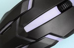 Closeup of a Black Gaming Optical Mouse on a Blue Background Stock Photo - Image of closeup, hardware: 135196302