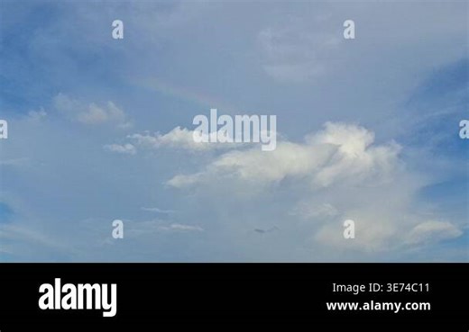 Rainbow in the daytime with cloudy sky Stock Video Footage - Alamy