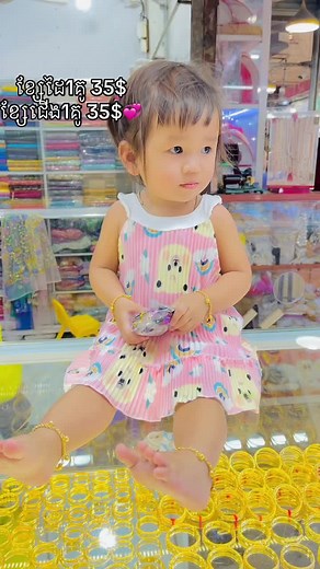 Toddler Jewelry Styling in a Colorful Store